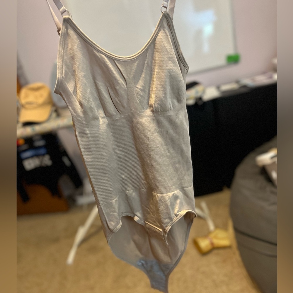 tan and black tank top body suits